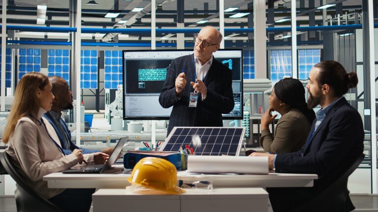 Businessmen in photovoltaics factory doing financial investments